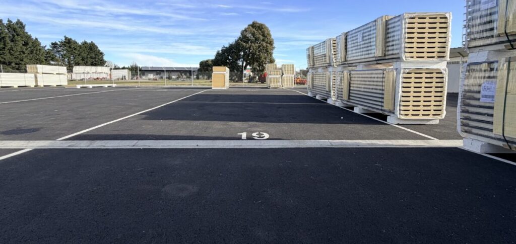Hybrid aluminium and recycled car tyre drainage channel ramp installed on a brand-new concrete driveway to eliminate harsh vehicle impacts and maintain water flow.